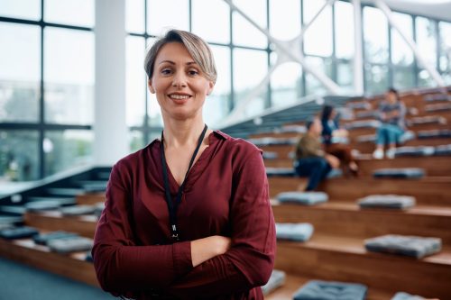 Confident businesswoman during an education event at convention center looking at camera. Copy space.